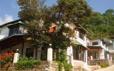 Closer exterior view of the cottages with traditional architecture and stone foundation